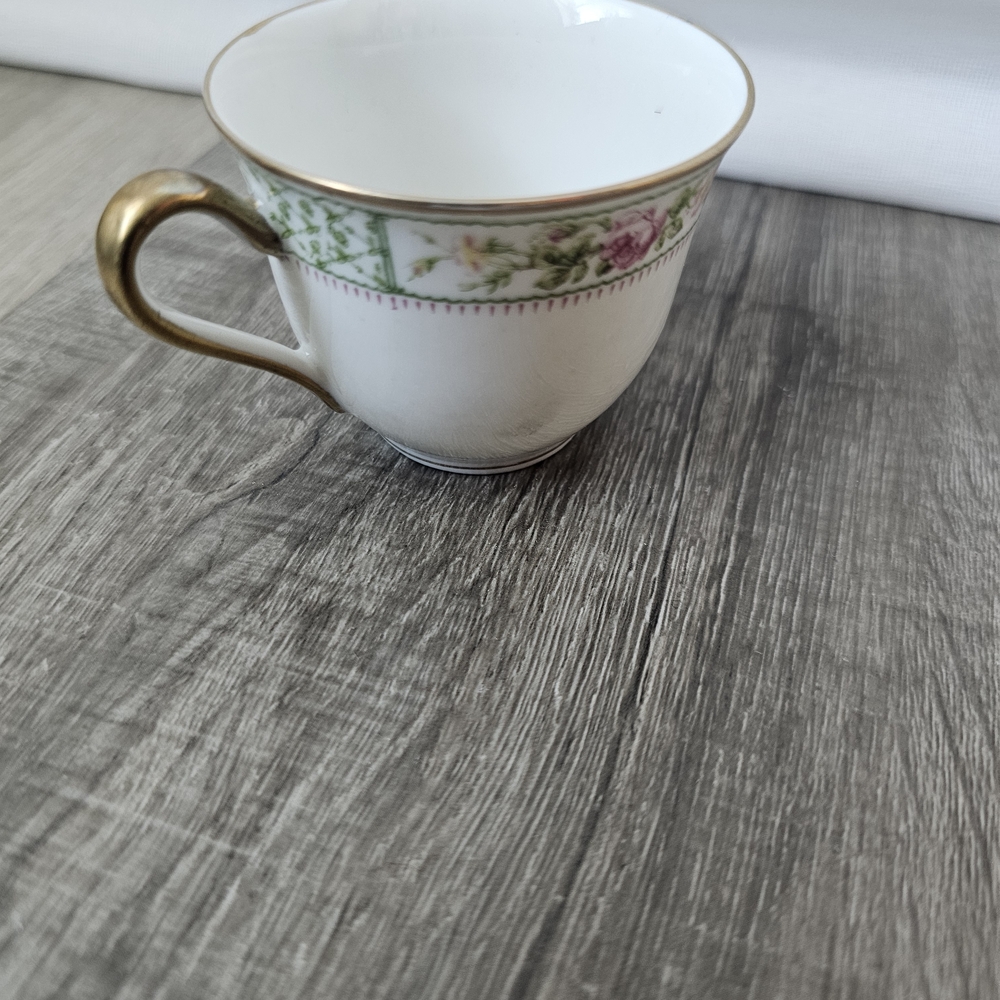 CharlesAhrenfeWhite Porcelain Teacup with Gold Handle and Pink-Green Floral Band